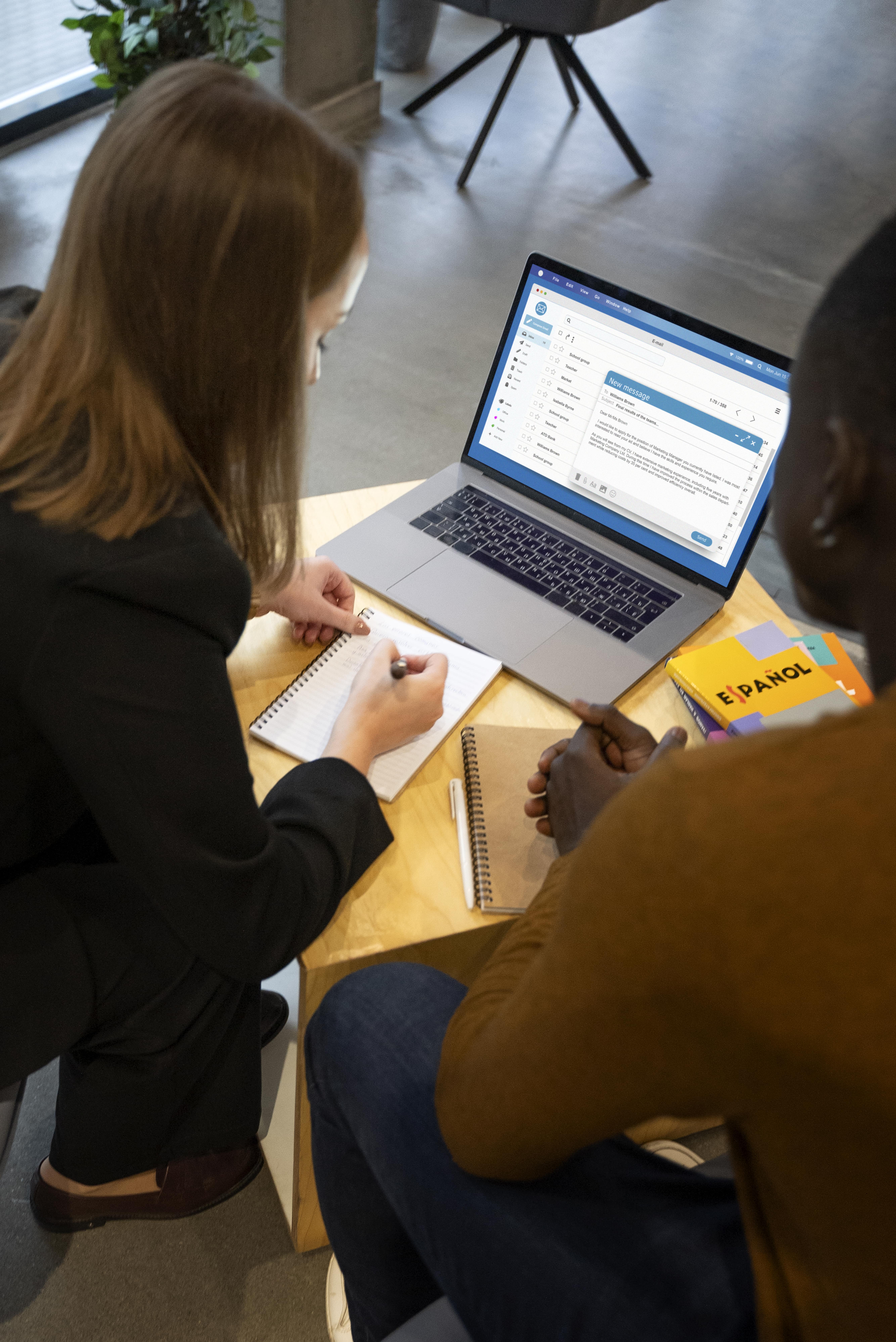 Team of professionals walking across a modern bridge